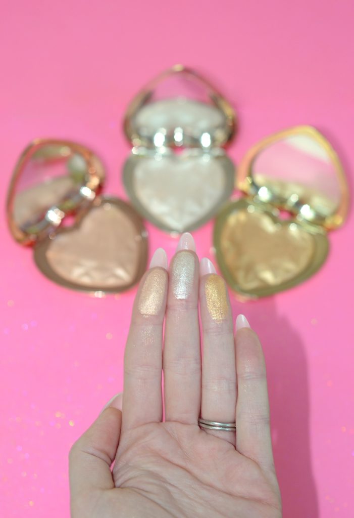 Los Angeles Cruelty-Free Beauty Blogger, Emily Wolf Beauty shares a review with swatches of the Too Faced Love Light Prismatic Highlighters.